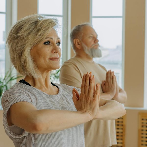 Man in a state of focus during a complex balancing exercise.